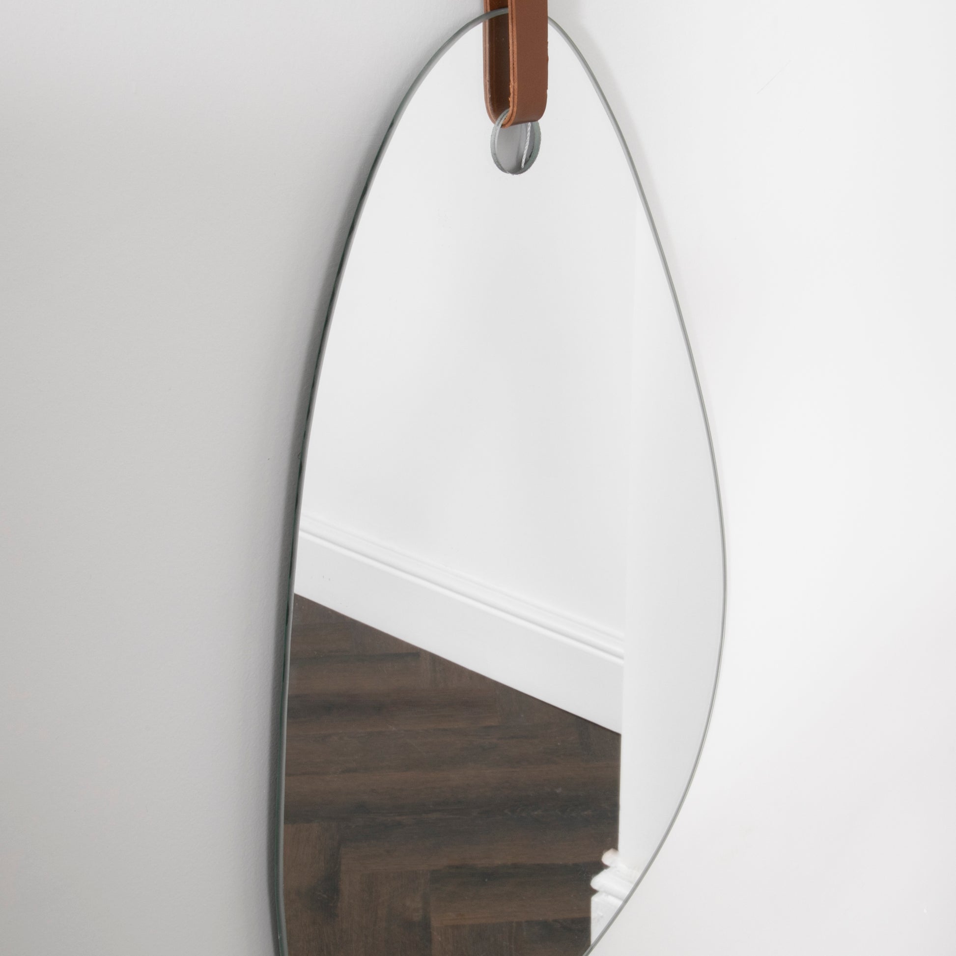 Pebble Shaped Mirror with Brown Leather Hanging Strap 50 x 26cm  CasaFenix